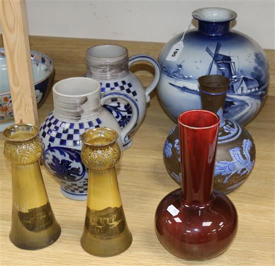 A Royal Bonn vase, two bottle vases, two jugs and two bulb neck vases